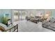 Bright living room with tile floors, stylish furnishings, and a sliding glass door leading to the patio at 2 Antigua Cir # 4, Englewood, FL 34223