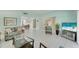 Open-concept living room with tile flooring, a neutral color palette, and a seamless flow to other spaces at 2 Antigua Cir # 4, Englewood, FL 34223