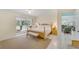 Expansive main bedroom with sunroom access, neutral decor, and smooth transition to living spaces at 2 Antigua Cir # 4, Englewood, FL 34223