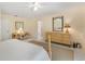 Comfortable main bedroom with accent lamps, soothing decor, and easy access to connecting bathroom at 2 Antigua Cir # 4, Englewood, FL 34223