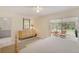 Spacious main bedroom with access to sunroom, warm neutral tones, and an inviting atmosphere at 2 Antigua Cir # 4, Englewood, FL 34223