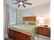 Comfortable bedroom with neutral walls, ceiling fan, and natural light from the window at 209 Okeeffe Cir, Bradenton, FL 34212