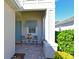 Inviting front porch with brick pavers and space for seating, creating a charming entry at 209 Okeeffe Cir, Bradenton, FL 34212
