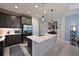Modern kitchen featuring an island, stainless steel appliances, and recessed lighting at 209 Okeeffe Cir, Bradenton, FL 34212