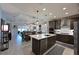 Spacious open kitchen featuring a large island and stainless steel appliances at 209 Okeeffe Cir, Bradenton, FL 34212