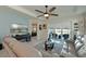 Comfortable living room with a large screen television and sliding glass doors to the outdoor patio at 209 Okeeffe Cir, Bradenton, FL 34212