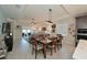 Open-concept living and dining area with tile floors and plenty of natural light at 209 Okeeffe Cir, Bradenton, FL 34212