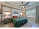 Serene main bedroom with a tray ceiling, decorative wall trim and a large window with blinds at 209 Okeeffe Cir, Bradenton, FL 34212