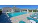 A luxurious community swimming pool with plenty of seating and shade at 209 Okeeffe Cir, Bradenton, FL 34212