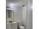 Neat half-bathroom with a single sink vanity and toilet, conveniently located at 216 Amherst Ave # 97, Sarasota, FL 34232