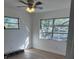 Inviting bedroom with wood-look floors, neutral paint, and natural lighting at 216 Amherst Ave # 97, Sarasota, FL 34232