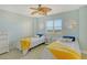 Bright bedroom featuring twin beds with white nightstands and two decorative mirrors at 2320 Terra Ceia Bay Blvd # 808, Palmetto, FL 34221