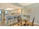 Cozy dining area with a glass table, comfortable seating, and a view into the kitchen at 2320 Terra Ceia Bay Blvd # 808, Palmetto, FL 34221