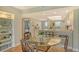 Inviting dining area with a glass-top table and seating, adjacent to a well-equipped kitchen and view at 2320 Terra Ceia Bay Blvd # 808, Palmetto, FL 34221