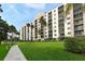 Manicured lawn and landscaping at a multi-story condominium building with balconies at 2320 Terra Ceia Bay Blvd # 808, Palmetto, FL 34221