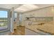 Bright kitchen features granite countertops, white cabinetry, modern appliances and a beautiful view from the window at 2320 Terra Ceia Bay Blvd # 808, Palmetto, FL 34221