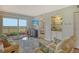 Comfortable living room with a balcony, TV, and a view into the bedroom, and a view of the landscape at 2320 Terra Ceia Bay Blvd # 808, Palmetto, FL 34221