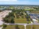 Expansive land parcel surrounded by lush greenery and mature trees in a serene neighborhood at 2900 Curry Ln, Nokomis, FL 34275