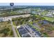 Wide aerial shot featuring a large land parcel in a community with ponds and easy highway access at 2900 Curry Ln, Nokomis, FL 34275