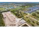 Expansive land parcel highlighted, showing neighborhood homes, ponds, and nearby construction at 2900 Curry Ln, Nokomis, FL 34275