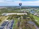 Wide angle aerial view of a large land parcel near the highway, local golf course, and community homes at 2900 Curry Ln, Nokomis, FL 34275
