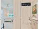 En-suite bathroom with shower, stylish floral artwork, and adjacent bedroom at 3008 Tolmino Ct, Lakewood Ranch, FL 34211