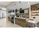 Stylish cafe area with modern lighting, wood accents, and comfortable seating at 3008 Tolmino Ct, Lakewood Ranch, FL 34211