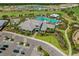 Aerial shot of the clubhouse with the pool, showcasing the community's luxurious amenities and meticulously landscaped grounds at 3008 Tolmino Ct, Lakewood Ranch, FL 34211