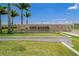 Stone community sign featuring 'Esplanade at Azario Lakewood Ranch' and lush landscaping at 3008 Tolmino Ct, Lakewood Ranch, FL 34211