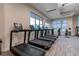 Well-lit gym with state-of-the-art treadmills and large windows at 3008 Tolmino Ct, Lakewood Ranch, FL 34211