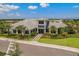 Beautiful exterior of a home featuring lush landscaping and a paver walkway, exuding curb appeal and elegance at 3008 Tolmino Ct, Lakewood Ranch, FL 34211