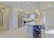 Well-lit kitchen featuring stainless steel appliances, a breakfast bar and modern pendant lighting at 3008 Tolmino Ct, Lakewood Ranch, FL 34211