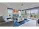 Spacious living room with a large window, modern furnishings and bright decor at 3008 Tolmino Ct, Lakewood Ranch, FL 34211