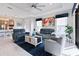 Bright living room featuring tile floors, modern furniture and a ceiling fan at 3008 Tolmino Ct, Lakewood Ranch, FL 34211