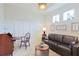 Cozy living room features a comfortable sofa, stylish decor, and plenty of natural light at 3008 Tolmino Ct, Lakewood Ranch, FL 34211
