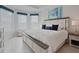 Comfortable bedroom featuring a well-made bed, plush pillows and bright sunlight at 3008 Tolmino Ct, Lakewood Ranch, FL 34211