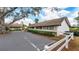Charming home featuring well-manicured landscaping, a fenced front yard, and a double-wide driveway at 3503 Longmeadow # 2, Sarasota, FL 34235