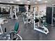 Weight training equipment in fitness center with multiple exercise stations, machines, and free weights in the community gym at 3503 Longmeadow # 2, Sarasota, FL 34235