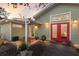 Backyard patio with a hot tub, outdoor seating, string lights, and a privacy fence at 3521 Almeria Ave, Sarasota, FL 34239