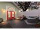 Backyard patio with a hot tub, outdoor seating, string lights, and a privacy fence at 3521 Almeria Ave, Sarasota, FL 34239