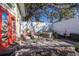 Landscaped backyard featuring a hot tub and outdoor seating area at 3521 Almeria Ave, Sarasota, FL 34239