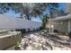 Outdoor oasis featuring a hot tub, lounge area, and lush tropical plants at 3521 Almeria Ave, Sarasota, FL 34239