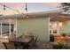 Backyard patio with outdoor seating and string lights, perfect for entertaining or relaxing at 3521 Almeria Ave, Sarasota, FL 34239