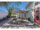 Charming backyard with a dining area, grill, and a relaxing space near the house at 3521 Almeria Ave, Sarasota, FL 34239
