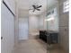 Bathroom featuring a large tub, spacious vanity, glass-enclosed shower, and ample natural light at 3521 Almeria Ave, Sarasota, FL 34239