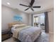 Comfortable bedroom featuring a beach-themed print and French door access to outdoor space at 3521 Almeria Ave, Sarasota, FL 34239