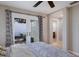 Bedroom with a ceiling fan and access to the outdoor patio at 3521 Almeria Ave, Sarasota, FL 34239