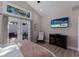 Bright bedroom features wood floors, vaulted ceiling, and French doors to private backyard at 3521 Almeria Ave, Sarasota, FL 34239