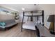 Bedroom featuring a bunk bed, futon, and ample natural light at 3521 Almeria Ave, Sarasota, FL 34239