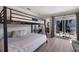 Bedroom with a bunkbed, desk, bathroom entrance and backyard access at 3521 Almeria Ave, Sarasota, FL 34239